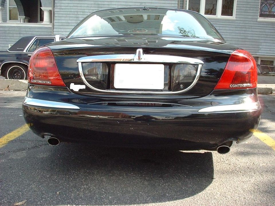 Black Lincoln Continental rear, chrome trim, Continental badging, dual exhaust pipes