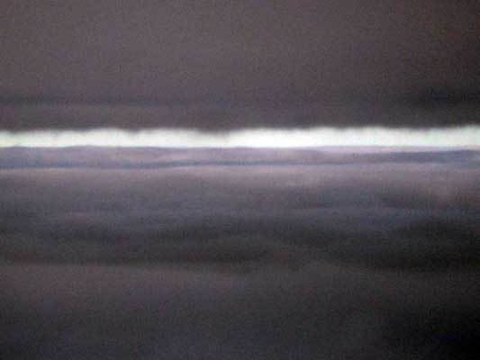 Dark clouds with a bright horizontal band of light