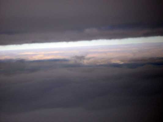 Clouds seen from above, with a bright band of light between layers