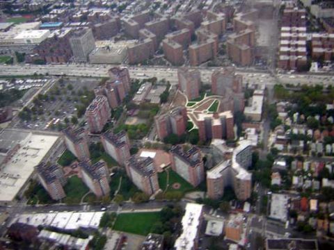 1995 Ford Bronco - An aerial perspective captures a cityscape numerous apartment complexes and a busy highway.