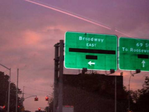 1995 Ford Bronco - Highway signs indicate directions for Broadway East and 69 St To Roosevelt.