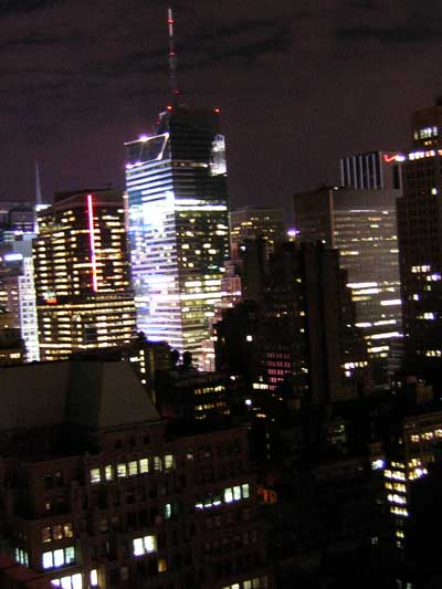 1995 Ford Bronco - Night view of the New York City skyline, numerous lit-up buildings.