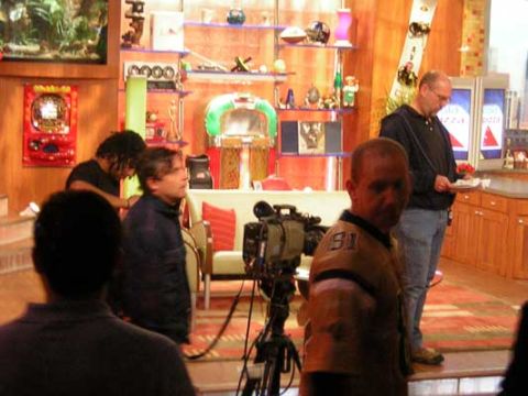 1995 Ford Bronco - A studio set is prepared for filming with a camera and crew members present.