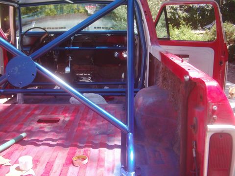 1978 Ford Bronco - Installing a blue roll cage inside a 1978 Ford Bronco.