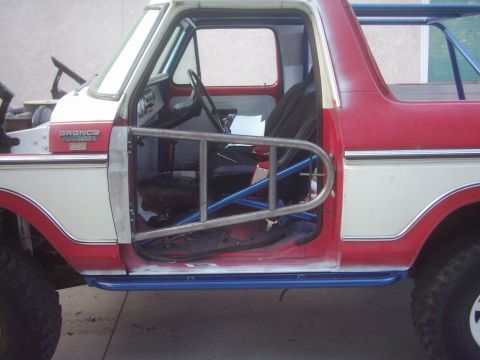 1978 Ford Bronco - This 1978 Ford Bronco features custom tube doors and a roll cage, indicating off-road modifications.