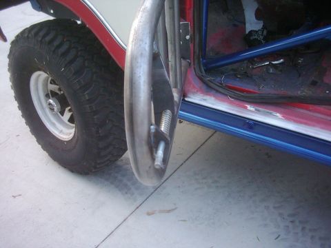 1978 Ford Bronco - Close-up of a custom tube door and off-road tire on a 1978 Ford Bronco.