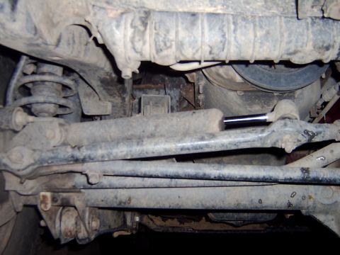 1998 Jeep TJ - Underside view of Jeep TJ suspension components, showing shocks and control arms.