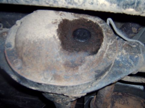 1998 Jeep TJ - The rear differential cover shows signs of rust and a dark, oily patch.