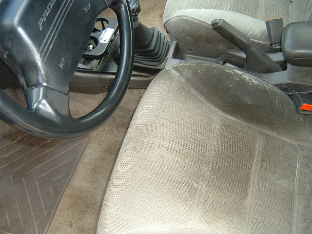 Ford Probe interior, gray cloth seats, manual shifter, steering wheel marked Probe