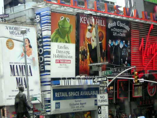 Times Square billboards advertising Mamma Mia, Kevin Hill, and Good Charlotte