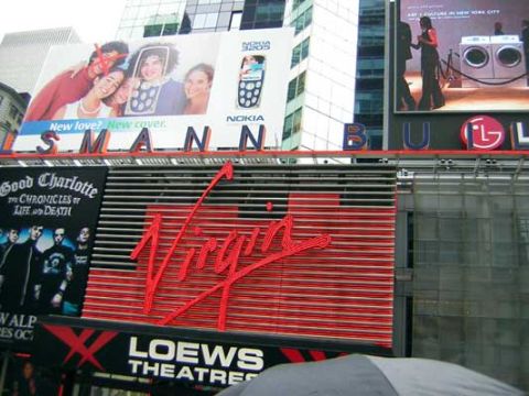 1995 Ford Bronco - A view of various billboards in Times Square, New York City, advertising different brands and events.