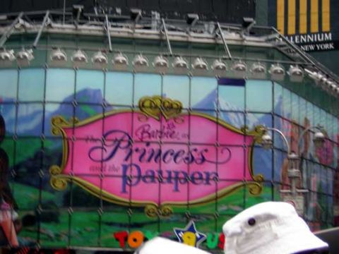 1995 Ford Bronco - A large billboard in Times Square advertises 'Barbie as the Princess and the Pauper'.