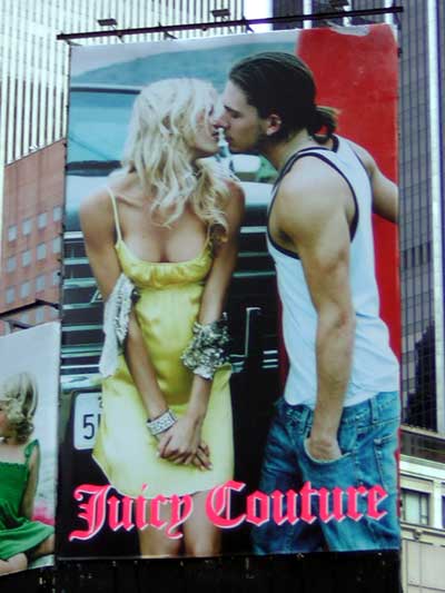 1995 Ford Bronco - Billboard advertisement for Juicy Couture a couple kissing.