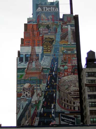1995 Ford Bronco - A vibrant mural covers the side of a building, a collage of famous global landmarks and city scenes.