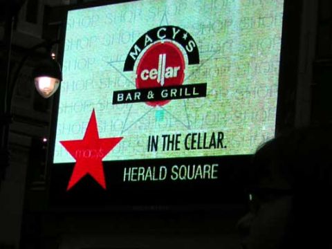 1995 Ford Bronco - Advertisement for Macy's Cellar Bar & Grill in Herald Square is displayed on a screen.