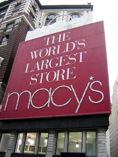 1995 Ford Bronco - Signage for Macy's, identified as the world's largest store, on a building facade.