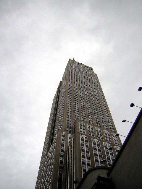 1995 Ford Bronco - Looking up at the iconic Empire State Building on a cloudy day.