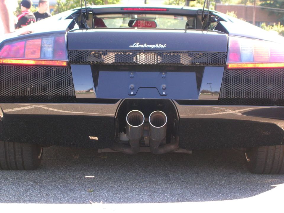 Rear view of dark blue Lamborghini Murcielago with twin center exhaust tips