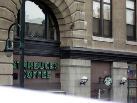 1995 Ford Bronco - Exterior view of a Starbucks coffee shop with its prominent green signage and architectural details.
