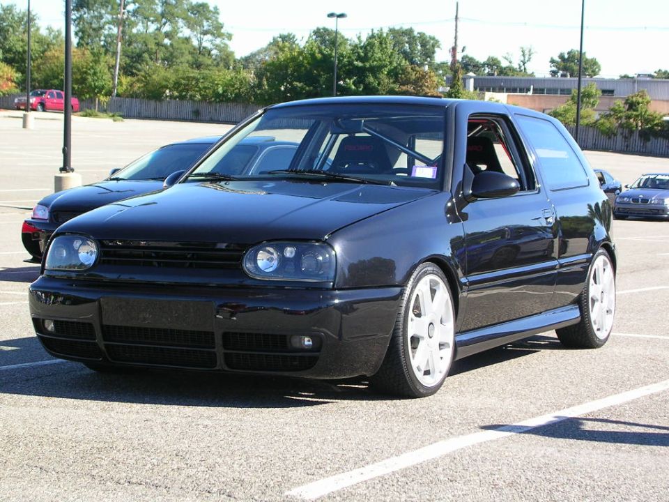 Black 1996 Volkswagen GTI 3q-front view with white wheels
