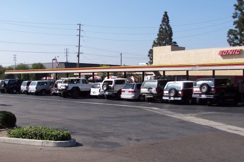 1990 Ford Bronco - Several Ford Broncos are parked in a row outside a Sonic restaurant, suggesting a meet-up or gathering.