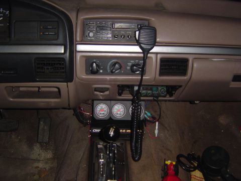 1993 Ford Bronco - Interior view of a 1992 Ford Bronco dashboard, showing aftermarket additions like a CB radio and gauges.