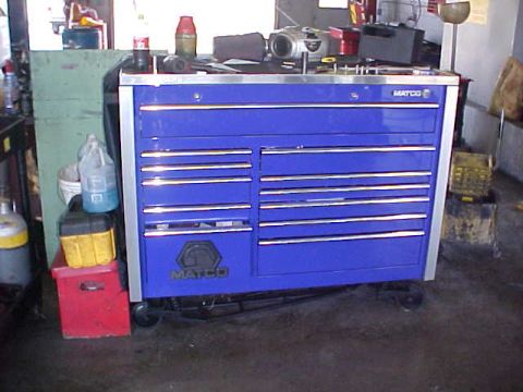 1992 Ford Bronco - A blue Matco tool chest sits on the floor with a red toolbox underneath.