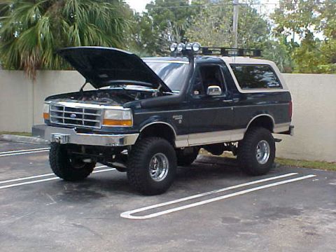 1992 Ford Bronco - This lifted 1992 Ford Bronco features a roof rack with auxiliary lights and a two-tone paint scheme.