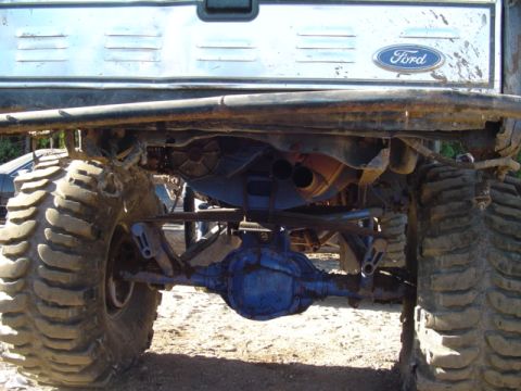 1993 Ford Bronco - This modified Ford truck features a heavy-duty rear axle and suspension system, with oversized tires for off-road use.