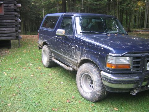 1994 Ford Bronco - This Ford Bronco has seen better days, covered in mud after an off-road adventure.