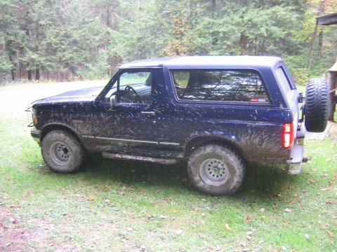 1994 Ford Bronco - This 1994 Ford Bronco is covered in mud, suggesting it has been used off-road.