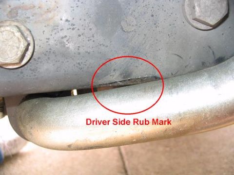 1999 Ford Crown Victoria - A close-up view of a vehicle part showing a marked area labeled 'Driver Side Rub Mark'.