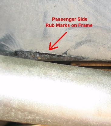 1999 Ford Crown Victoria - This photo shows rub marks and damage on the passenger side frame of a vehicle.