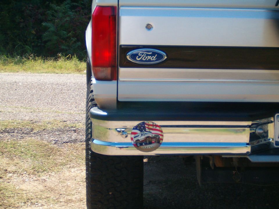 Rear bumper with Ford logo and a circular sticker depicting trucks