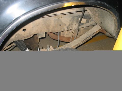 1988 Ford Bronco - Close-up view of the rear suspension components and wheel well, with Supermotors.net branding visible.