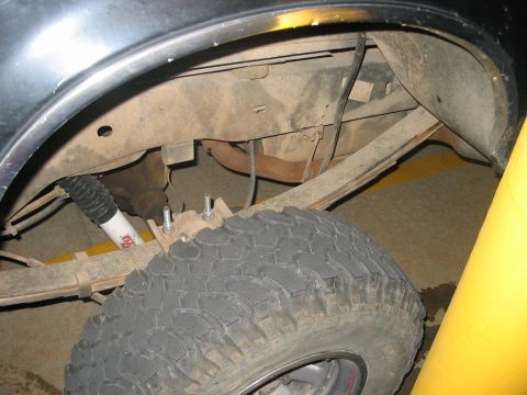 1988 Ford Bronco - Close-up of the rear suspension and tire assembly on a 1988 Ford Bronco.