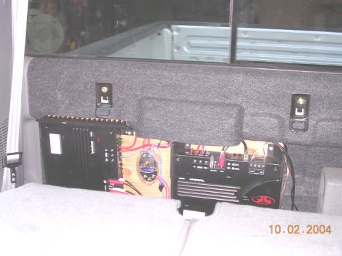 2004 Ford F-250 - Custom stereo amplifier installation in a vehicle's rear interior, with a date stamp of 10.02.2004 visible.