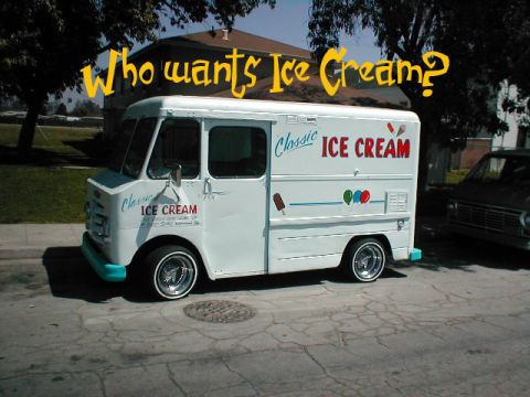 1986 Pontiac Fiero - A classic ice cream truck is parked on a residential street, asking 'Who wants Ice Cream?'.