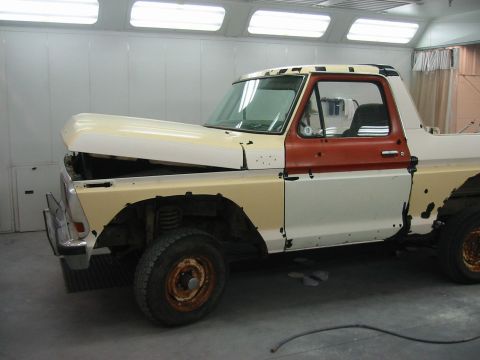1992 Ford Bronco - This truck appears to be undergoing bodywork and painting in a professional booth.