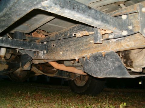 1991 Ford Bronco - The underbody of a 1991 Ford Bronco reveals its robust frame and exhaust system.