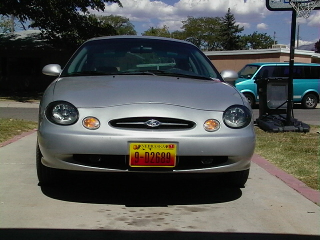 Silver 1999 Ford Taurus front view with Nebraska license plate
