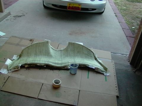 1999 Ford Taurus - A custom fiberglass car stereo component is laid out on cardboard, ready for installation.