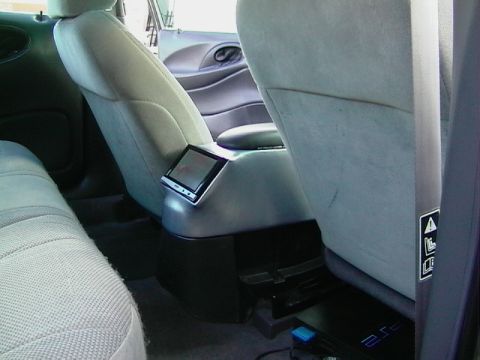1999 Ford Taurus - Aftermarket screen installed in the center console of a car's interior.
