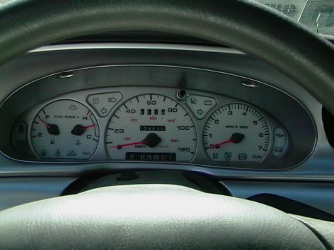 1999 Ford Taurus - Interior view of a 1999 Ford Taurus dashboard with a mileage of 128,617.