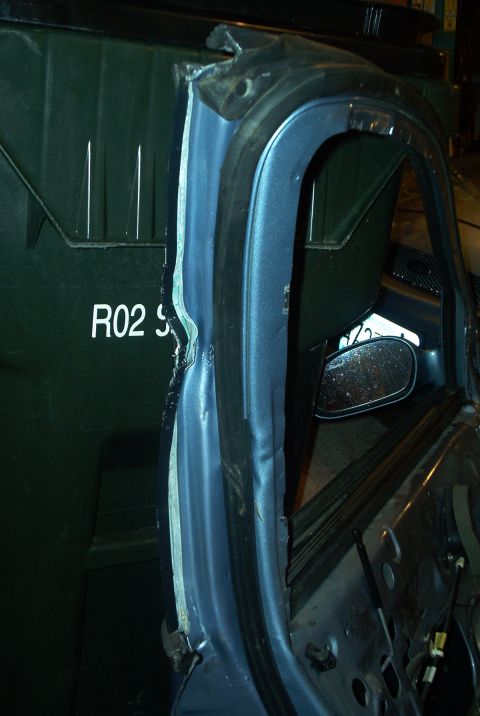1998 Ford Taurus - Here you can see where the curl was/is... I tried to pull it out with some clamps and good ole fashion elbow grease, but the door still wou…