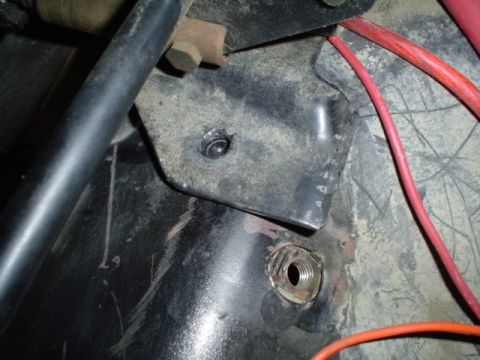 1981 Ford Bronco - pass front lh mounting tab ready to drill the hole in floor.