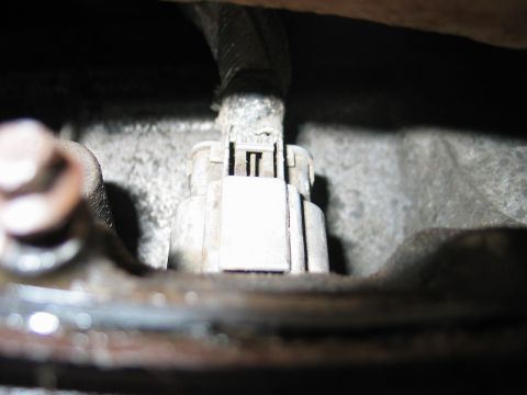 1995 Ford Bronco - Remove the plug on the passenger's side of the tranny.