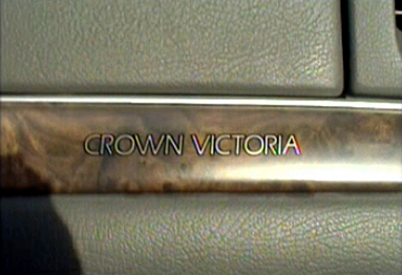 2000 Ford Crown Victoria - Interior trim piece showing 'CROWN VICTORIA' text, likely from a 2000 model.