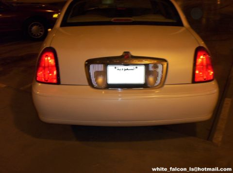 2000 Ford Crown Victoria - Rear view of a white 2000 Ford Crown Victoria, its taillights and a license plate from Saudi Arabia.