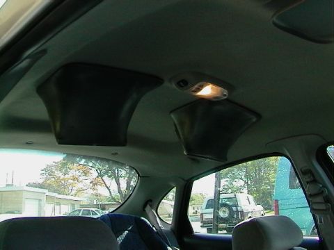1999 Ford Taurus - Aftermarket speaker pods are mounted to the headliner of this vehicle's interior.